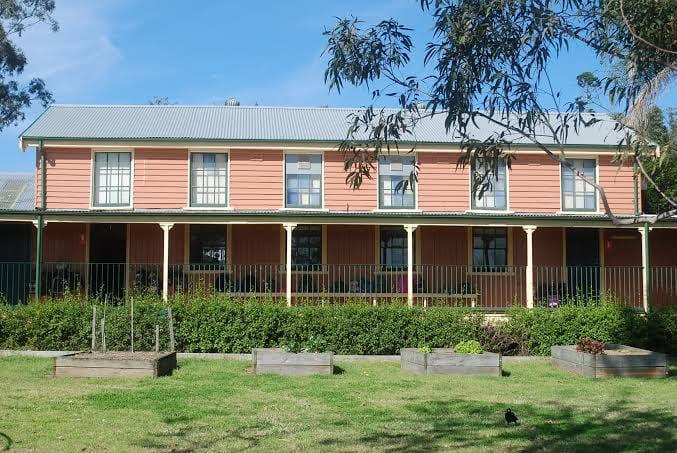 Largs Public School heritage building and garden beds.